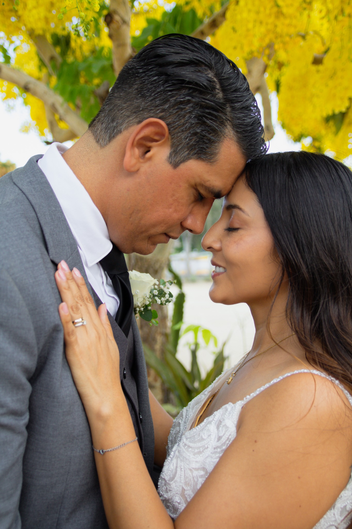 Newlyweds touching foreheads