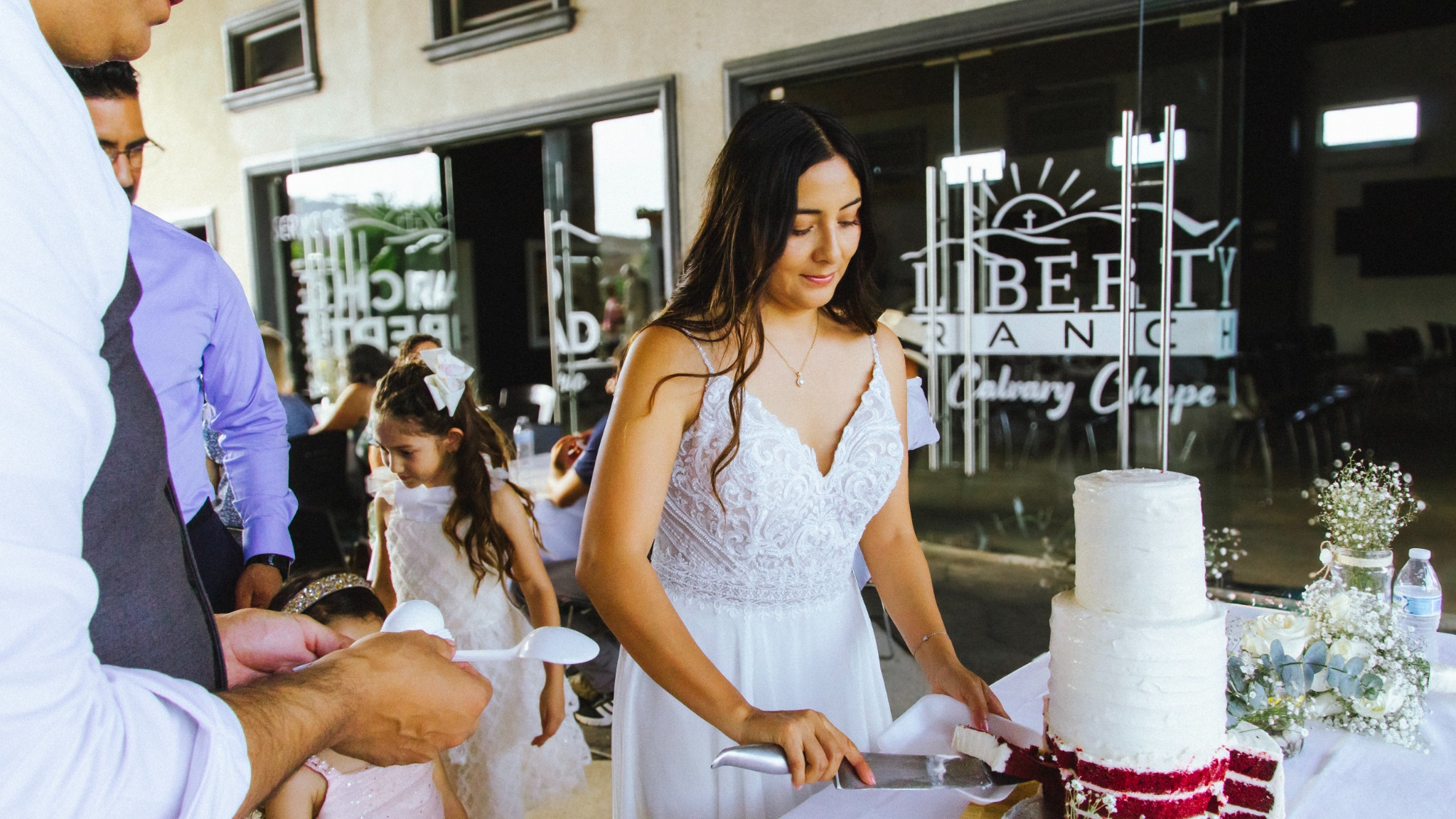 Newlyweds cutting their wedding cake